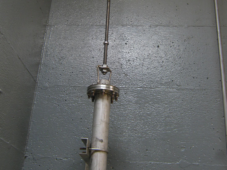 Connecting stem attached to bail which holds the slip tube that is sealed to the receiving tube.