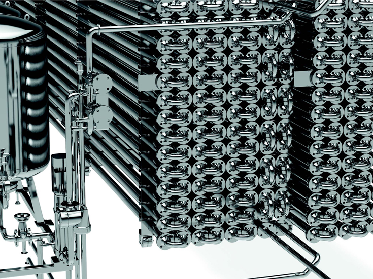 Using a series of heat exchangers, sludge is continuously heated 