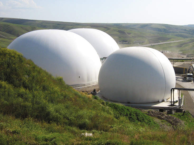 Three anaerobic digester covers above tanks store high volume gas for recovery and reuse