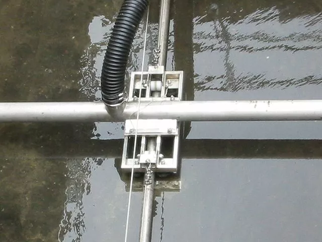 The Trac-Vac Sludge Collector travels along the basin floor 